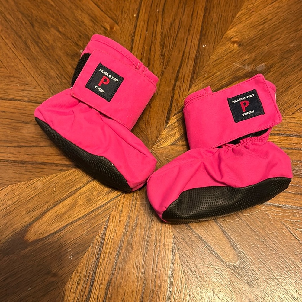 Hot pink baby booties.